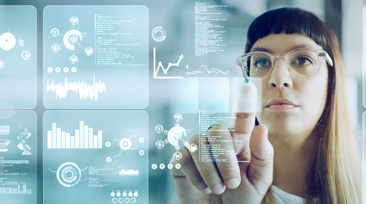 Woman working on a touchscreen in an office