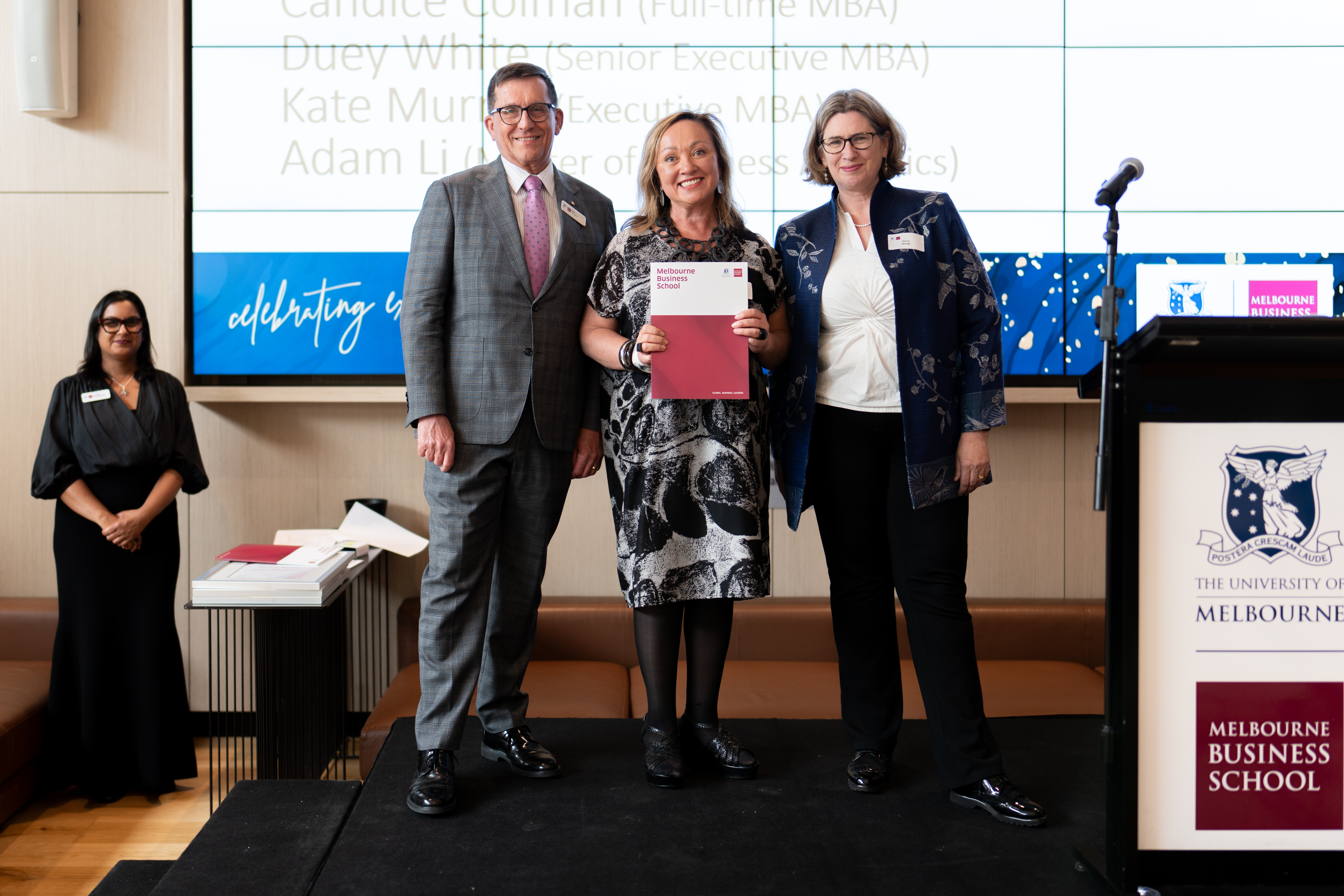 Student with Ian Harper and Jenny George at the Celebrating Excellence award ceremony at Melbourne Business School