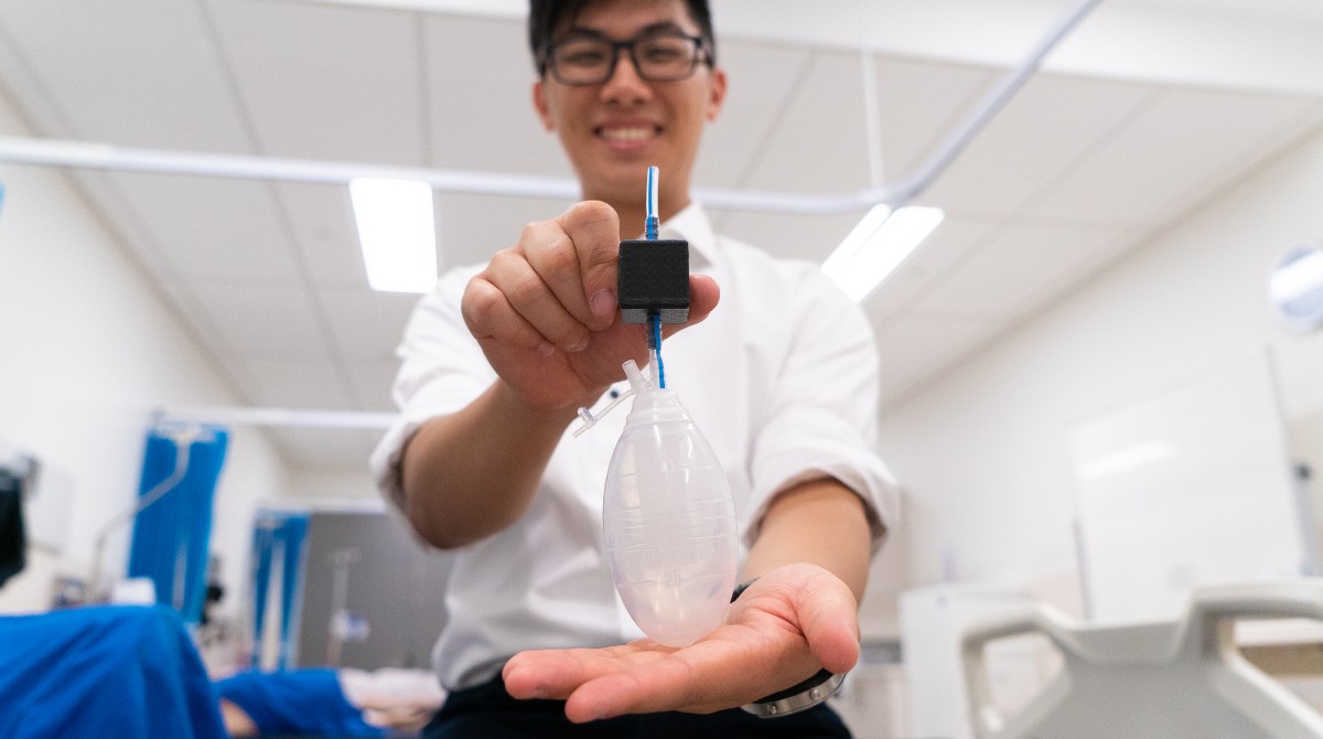 University of Melbourne engineering student James Lo with the device his team created on the BioDesign Innovation subject